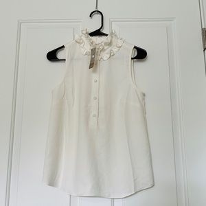 JCrew cream colored blouse with ruffle neckline
